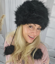 Fluffy winter beanie with pom-poms on strings