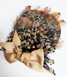 Elegant women's panama hat with decorative brooch with feathers and beads