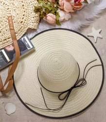 Elegant women's straw hat with a ribbon