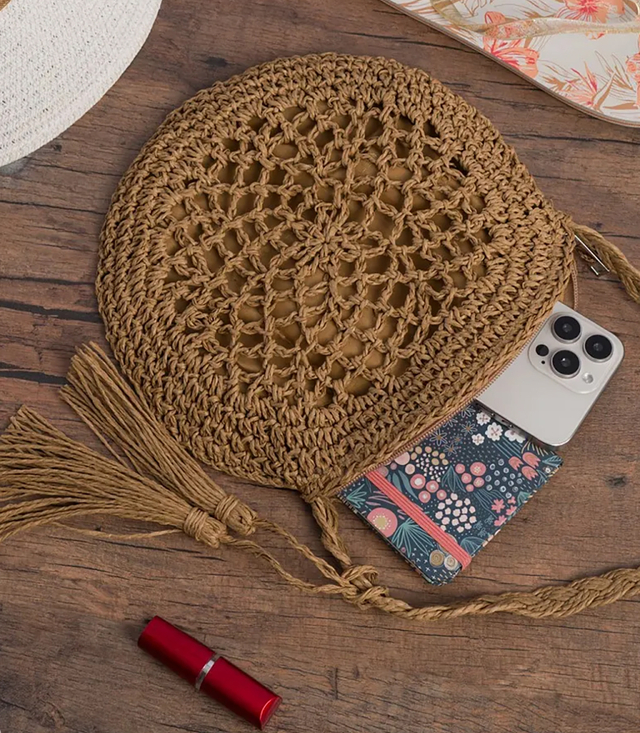 Round small summer shoulder bag made of paper raffia