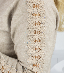 Knit dress with openwork sleeves and pockets