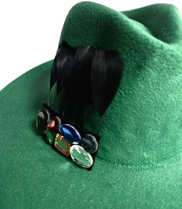 Elegant women's fedora hat with decorative brooch with colored zircons