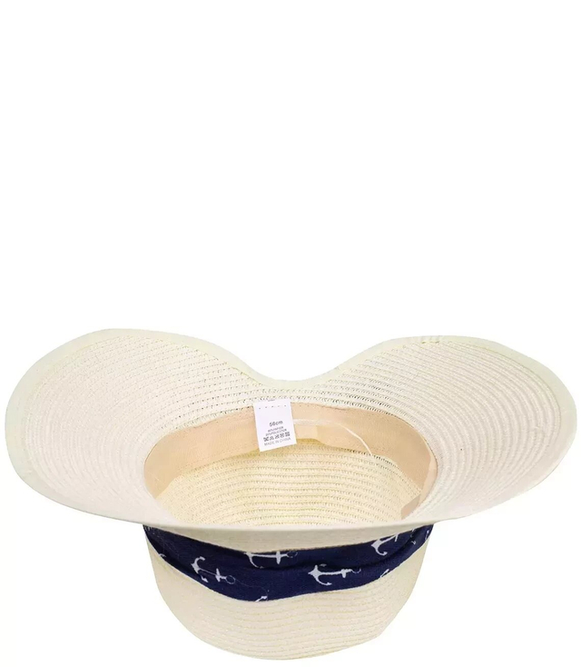 Stylish straw hat with a bow in anchors