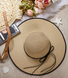 Elegant women's straw hat with a ribbon