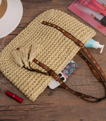 Stylish boho handbag with decorative studs and tassels
