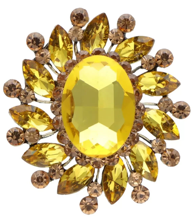 Beautiful decorative gold brooch with zircons