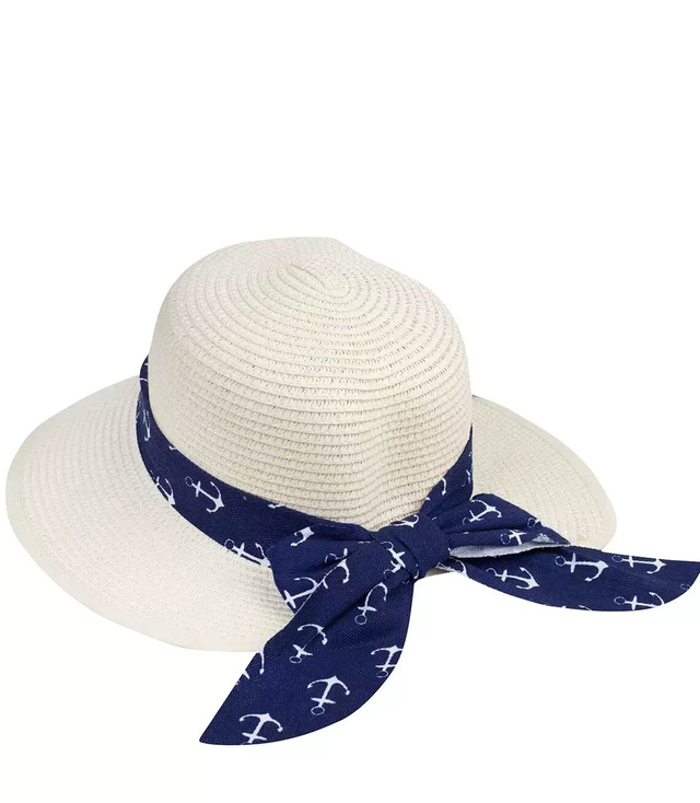 Stylish straw hat with a bow in anchors