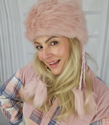 Fluffy winter beanie with pom-poms on strings