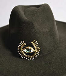 Elegant women's panama hat with decorative brooch "Eye of Elegance"