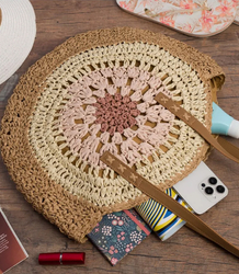 Large round braided handbag with openwork pattern