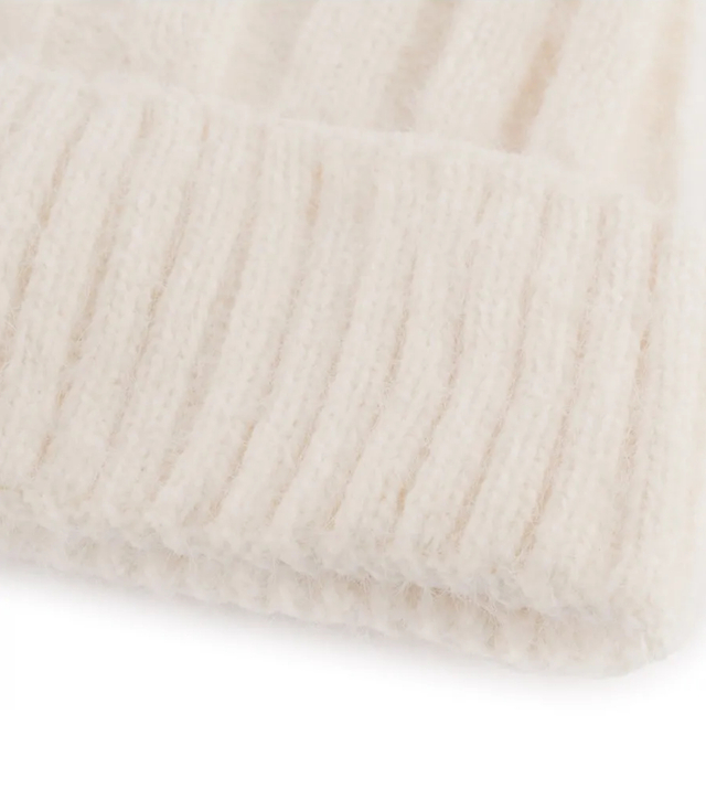 Warm women's beanie with pom-pom in ribbed weave autumn winter