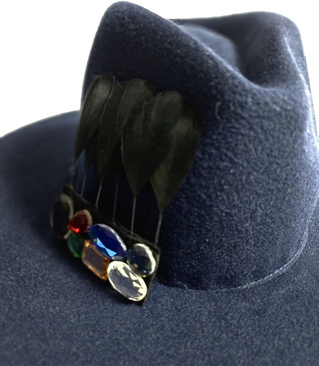 Elegant women's fedora hat with decorative brooch with colored zircons