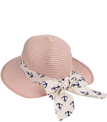 Stylish straw hat with a bow in anchors