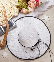 Elegant women's straw hat with a ribbon