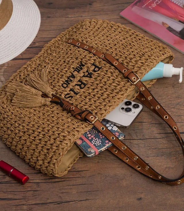 Stylish boho handbag with decorative studs and tassels
