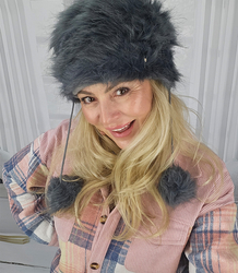 Fluffy winter beanie with pom-poms on strings