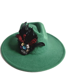 Elegant women's hat with large brooch with feathers and colored zircons