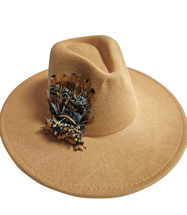 Elegant women's panama hat with decorative brooch with feathers and beads