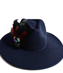 Elegant women's hat with large brooch with feathers and colored zircons