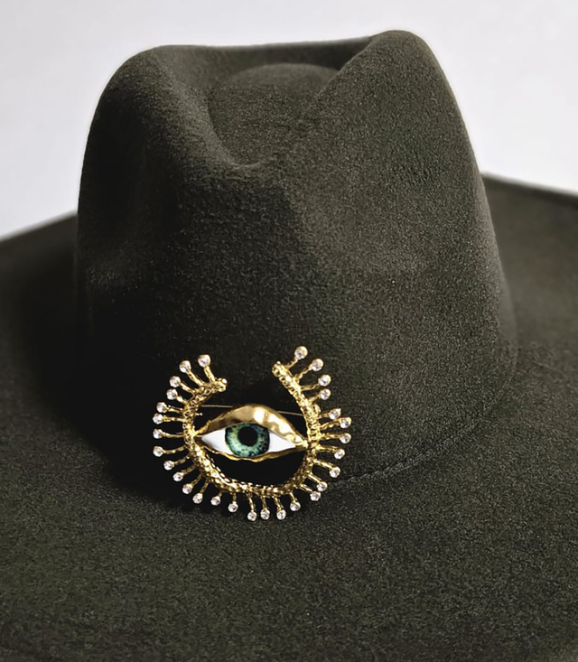 Elegant women's panama hat with decorative brooch "Eye of Elegance"