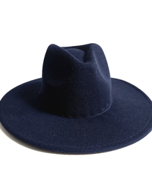 Elegant women's fedora hat with decorative brooch with colored zircons