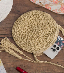 Round small summer shoulder bag made of paper raffia