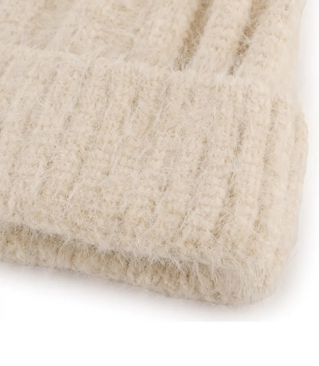 Warm women's beanie with pom-pom in ribbed weave autumn winter