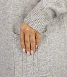 Knit dress with openwork sleeves and pockets