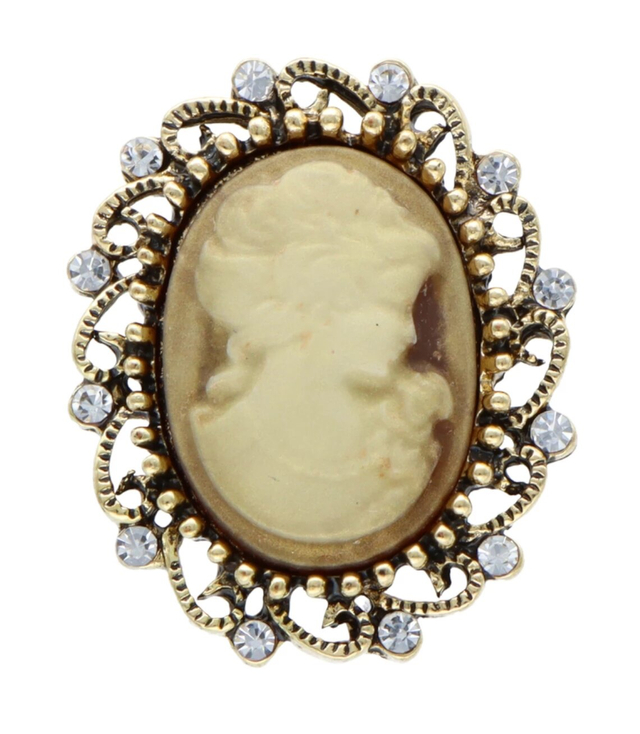 Brooch with zircons and crystals. Beautiful decorative gold safety pin