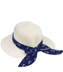 Stylish straw hat with a bow in anchors