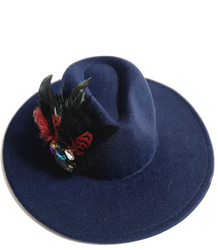 Elegant women's hat with large brooch with feathers and colored zircons