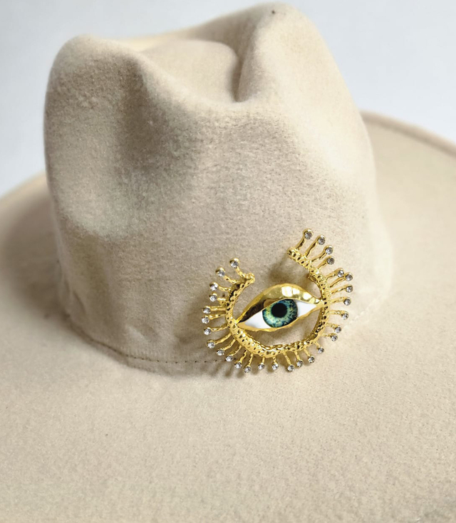 Elegant women's panama hat with decorative brooch "Eye of Elegance"