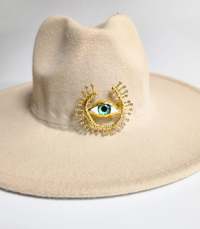 Elegant women's panama hat with decorative brooch "Eye of Elegance"