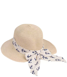 Stylish straw hat with a bow in anchors