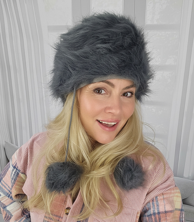 Fluffy winter beanie with pom-poms on strings