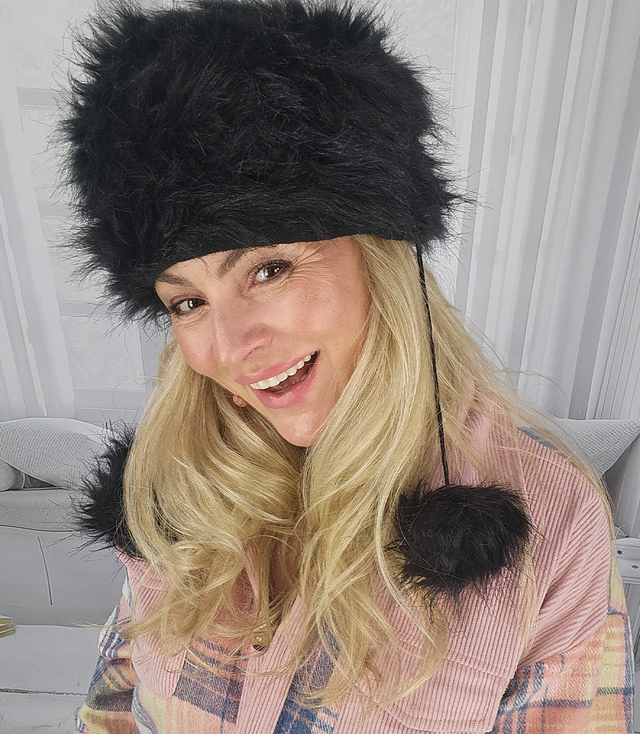 Fluffy winter beanie with pom-poms on strings